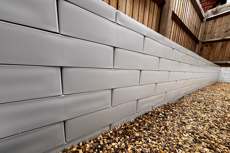 Recycled plastic building block wall
